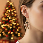 Pair of unique gingerbreade earrings on a cardboard backing